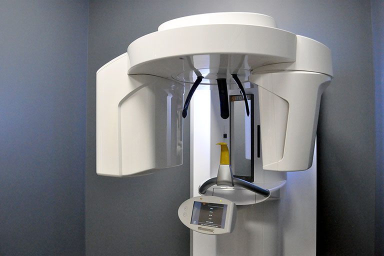 A cone beam computed tomography machine sits vacant and ready to X-ray the next patient's teeth and jaw at Midtown Dental.