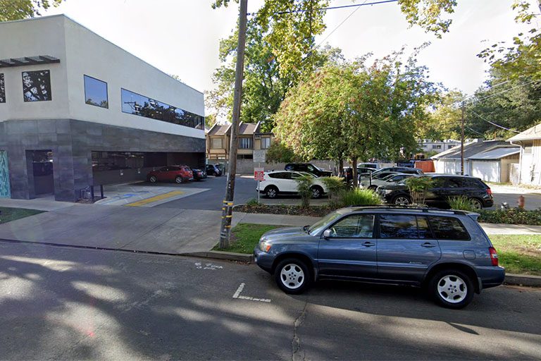 Parking spaces behind of Midtown Dental office building